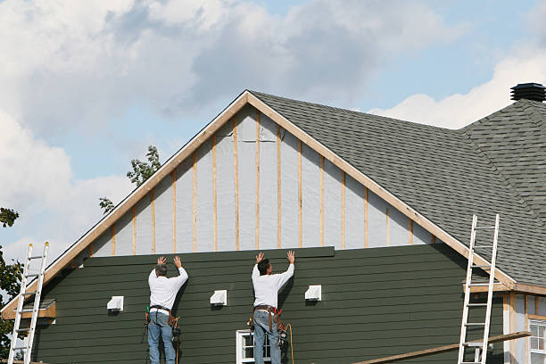 Professional Storm Damage Siding Repair technician working in Freeport, NY